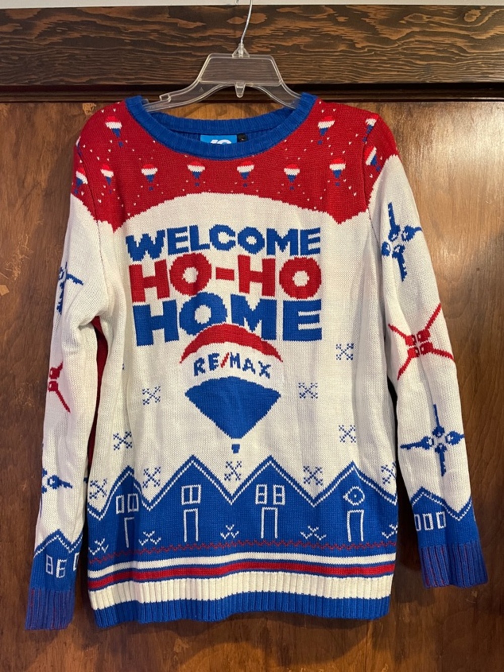 'Welcome Ho-Ho Home' Holiday Sweater - White/Red/Blue Remax logo